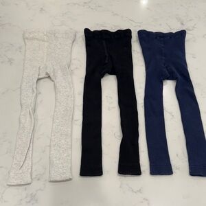 Hanna Andersson light gray, black, and navy footless tights.